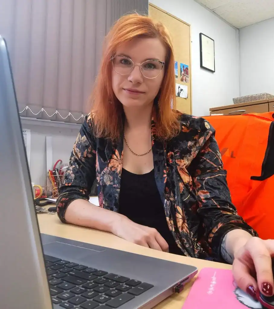 Katarzyna Sural, HR Manager at IKON Aluminium Systems, working at her desk in the office