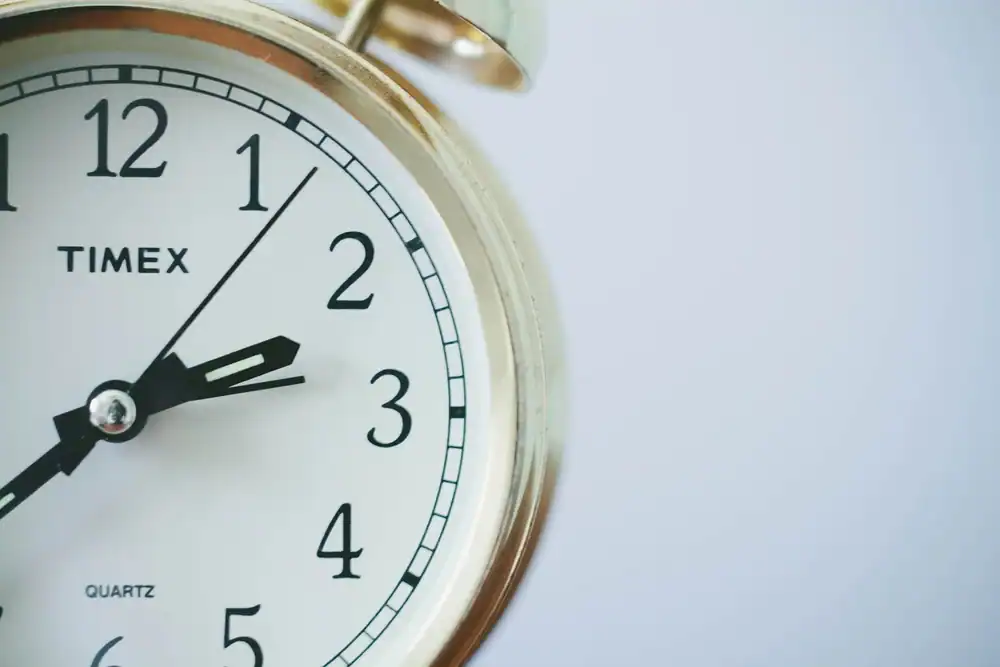 Close-up image of a clock face used to illustrate office hours and time changes